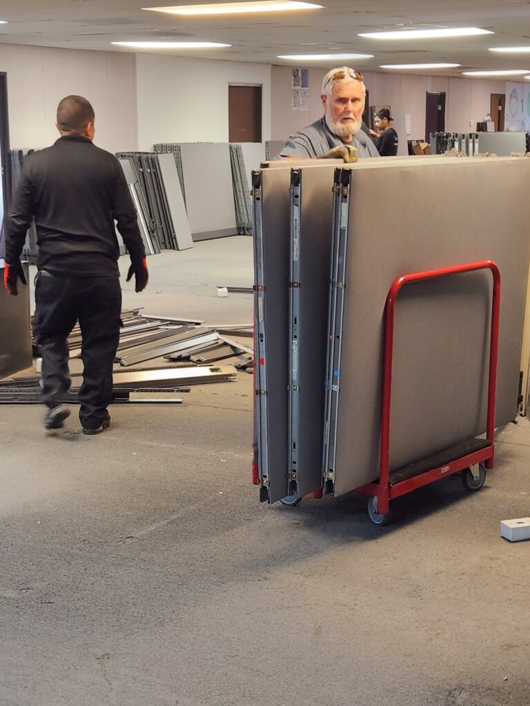 Professional installation of modular panels at Cube World USA.