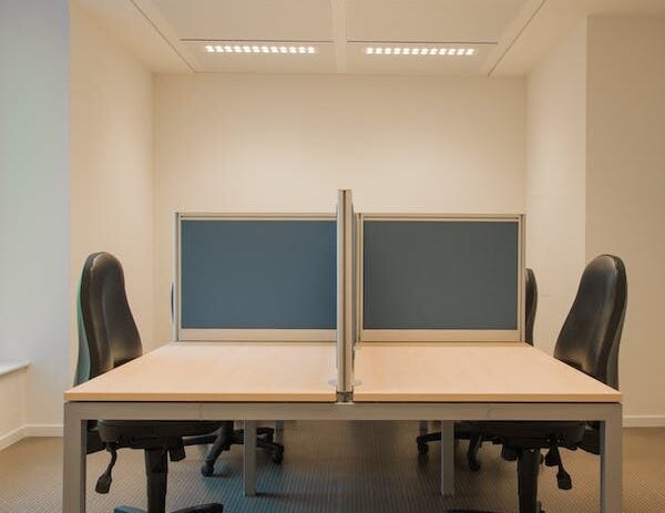 Office cubicles with privacy panels and ergonomic chairs for productive work environments.