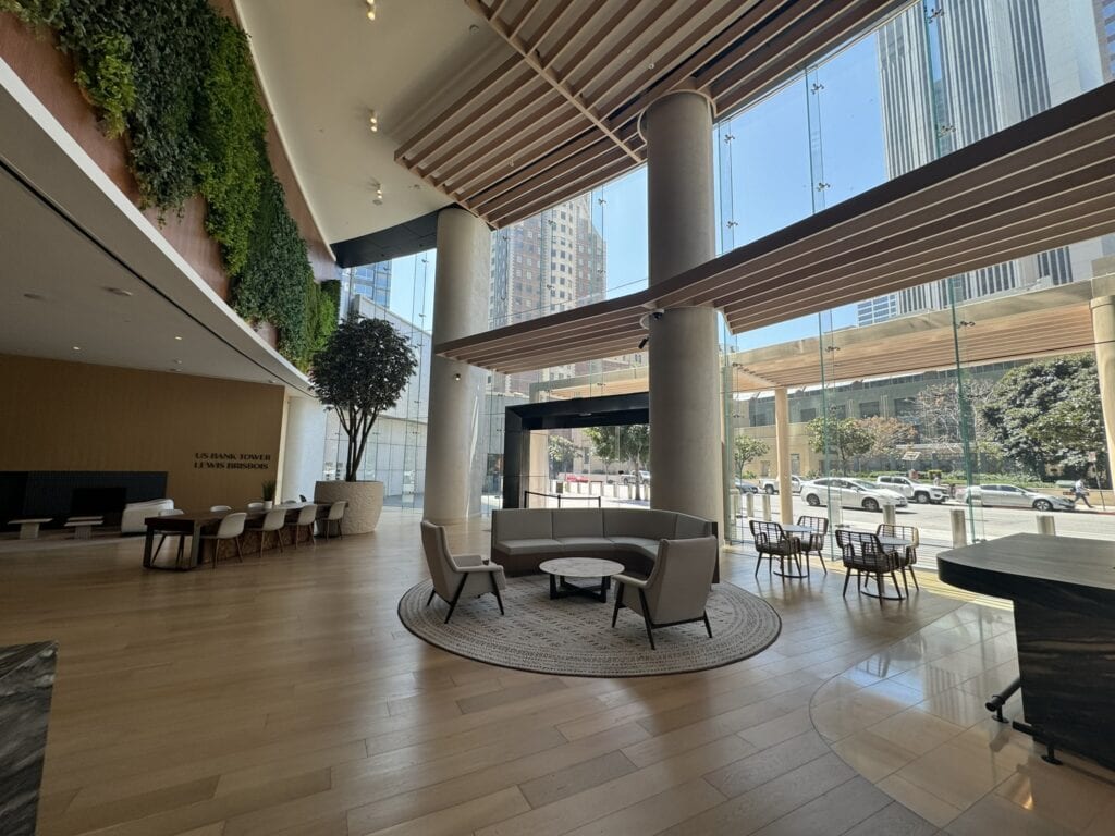 Modern lobby featuring large glass windows and stylish seating areas at Cube World USA.
