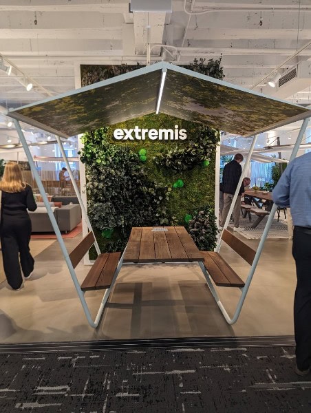 Extremis outdoor seating with green wall at NeoCon 2024.