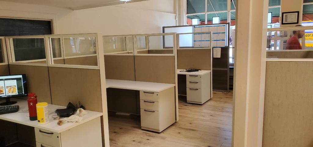 Office cubicles with desks and storage for productive work environments.