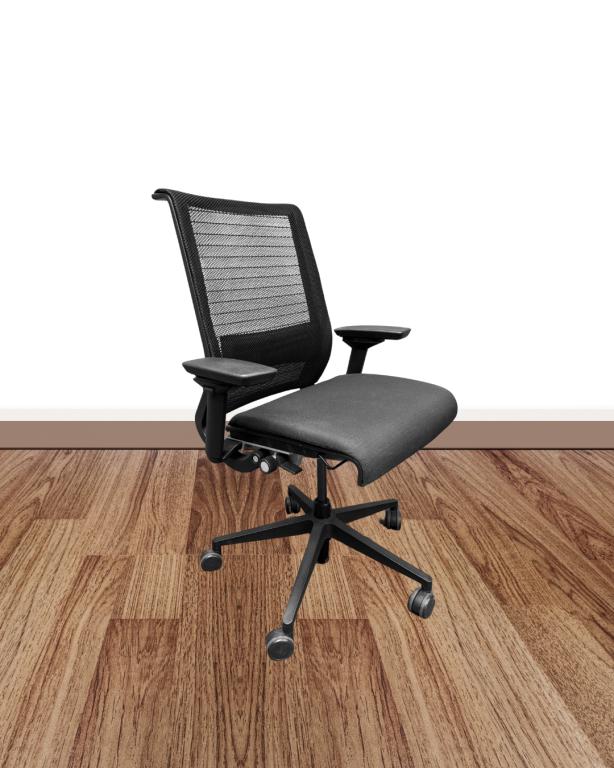 Ergonomic used office chair with mesh back and adjustable features for productivity.