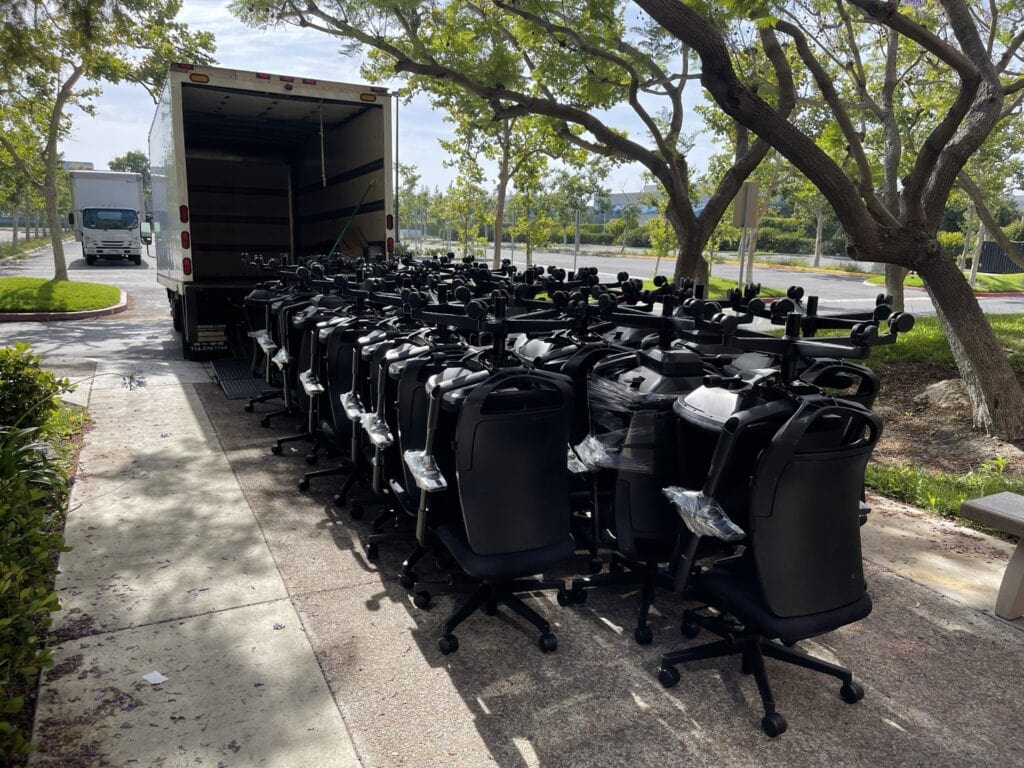Office chairs and cubicles ready for liquidation at Cube World USA.