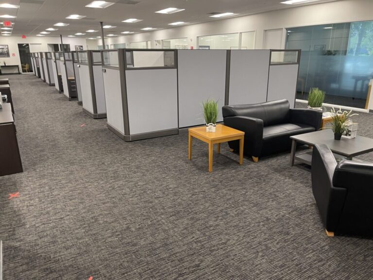 Office cubicles and lounge space with modern furniture at Cube World USA. Perfect for maximizing off.