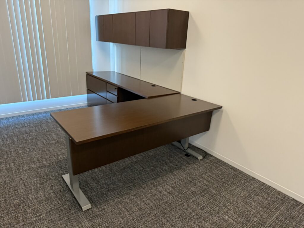 Office furniture desk with attached storage cabinets, ideal for professional workspaces. Perfect for.