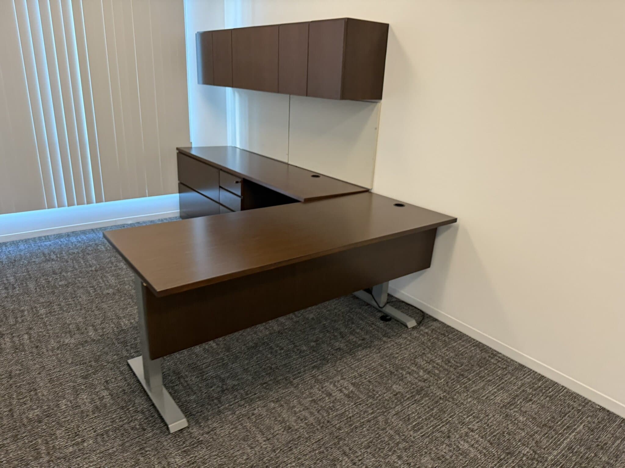 Office furniture desk with attached storage cabinets, ideal for professional workspaces. Perfect for.