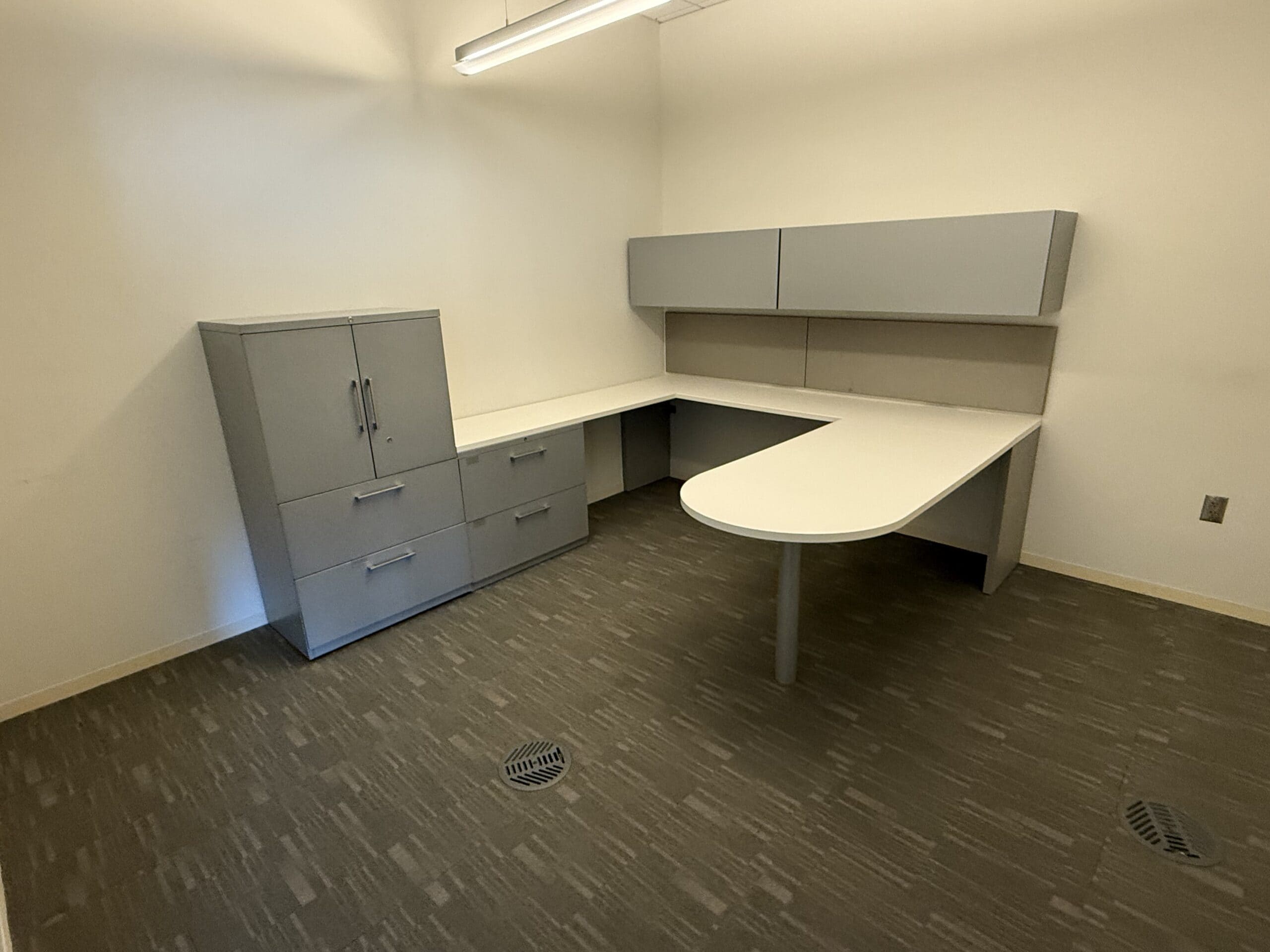 Modern Haworth U-shaped executive office set with storage and workspace.